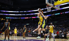 : Dearica Hamby #5 of the Los Angeles Sparks is fouled by Maddy Siegrist #20 of the Dallas Wings