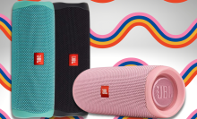 jbl flip 5 speakers in black, pink, and teal with rainbow striped background