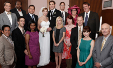 The cast of "The Office" posing for a group wedding photo while filming the "Niagara" episode.