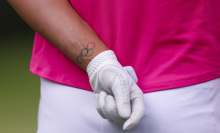 A detailed view of the Olympic rings tattoo on the wrist