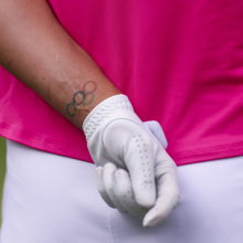 A detailed view of the Olympic rings tattoo on the wrist