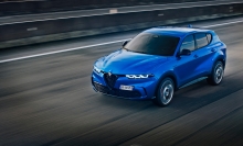 A blue SUV on a highway