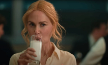 Nicole Kidman drinking a glass of milk, like a good girl, in the A24 movie 'babygirl'