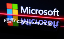 The OpenAI and Microsoft logos projected on a shiny black wall. 