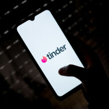 Tinder logo on phone screen