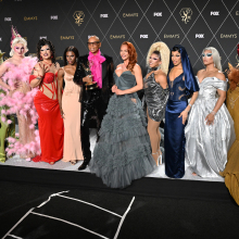 RuPaul and drag queens posing at the Emmy's.