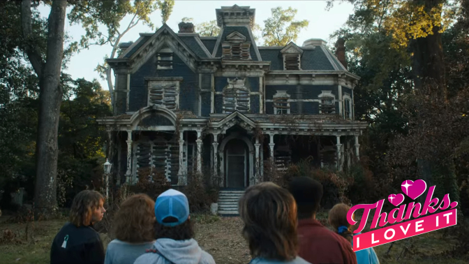 A group of young people stand outside an abandoned, boarded up, old Victorian house.