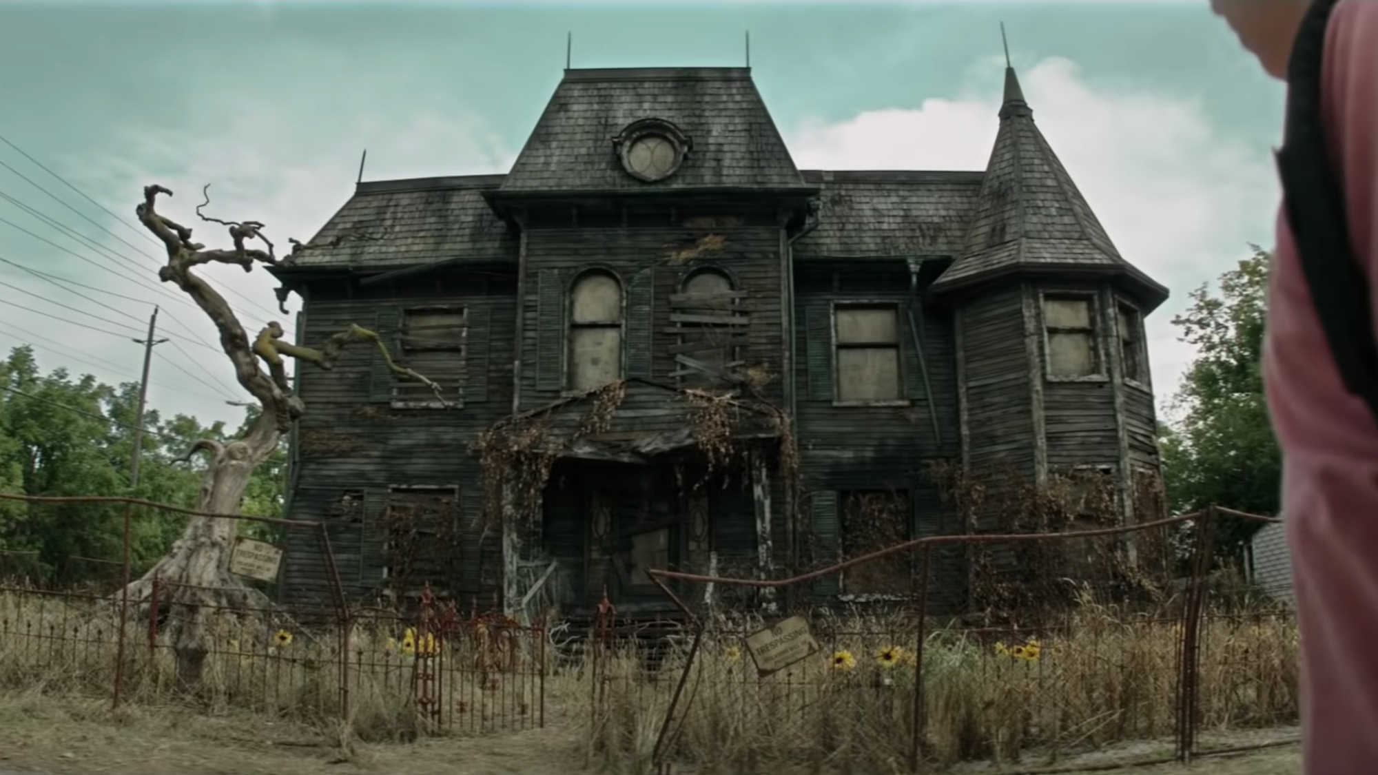 Another old spooky house, abandoned and boarded up.