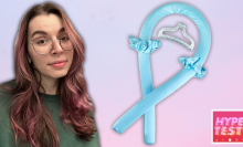 A composite of a woman with curly hair (Mashable's Lily Kartiganer) alongside a light blue heatless curling headband. They are set against a pink and purple backdrop.