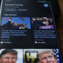 Trump assassination attempt news on a phone