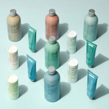 Bottled personal care products on turquoise backdrop