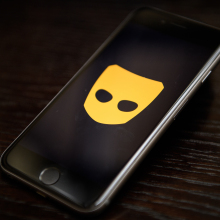 grindr logo on smartphone