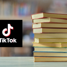 Stack of books next to the TikTok logo. 