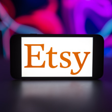 Etsy logo is seen displayed on a mobile phone screen