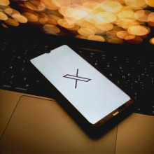 X logo on mobile device