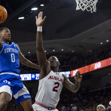 Rob Dillingham #0 of the Kentucky Wildcats looks to pass the ball in front of Jaylin Williams #2 of the Auburn Tigers during the first half of play at Neville Arena on Feb. 17, 2024, in Auburn, Alabama.