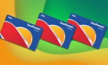 three southwest airlines gift cards appear in a line on a diagonal. the background is wavy yellow and green