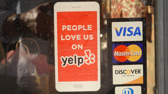 Yelp sticker on local business door