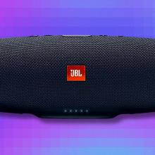 JBL Charge 4 portable speaker on blue and purple abstract background