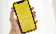 logo for Bumble is displayed on a smartphone