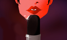 bottom half of a woman's face in front of a microphone