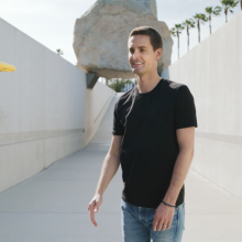 Snapchat CEO Evan Spiegel watches a yellow drone.