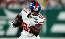 Isaiah McKenzie of the New York Giants runs the ball