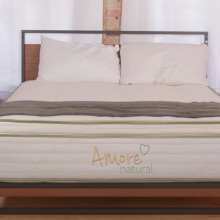 Amore Natural Hybrid Mattress (Queen) in a bedroom.