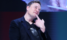 elon musk posing with a finger under his chin