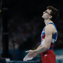 American gymnast Stephen Nedoroscik chalking up before the pommel horse event. 