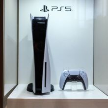 PS5 and controller in display case