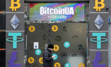 A man walks past a cryptocurrency exchange point in the center of Kyiv, Ukraine on 24 January 2022.