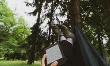 Kindle on lap in hammock