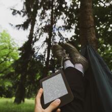 Kindle on lap in hammock