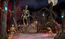 the 12-foot home depot skeleton next to its 7-foot skelly's dog in a spooky setting