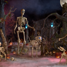 the 12-foot home depot skeleton next to its 7-foot skelly's dog in a spooky setting