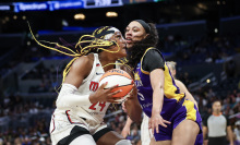 Aaliyah Edwards #24 of the Washington Mystics drives to the basket defended by Dearica Hamby #5 of the Los Angeles Spark