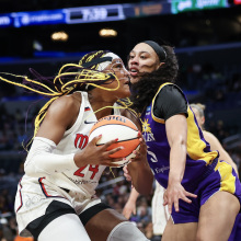 Aaliyah Edwards #24 of the Washington Mystics drives to the basket defended by Dearica Hamby #5 of the Los Angeles Spark