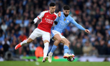 Josko Gvardiol of Manchester City is challenged by Gabriel Martinelli