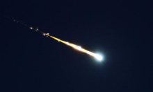 A fireball breaking apart in Earth's atmosphere.