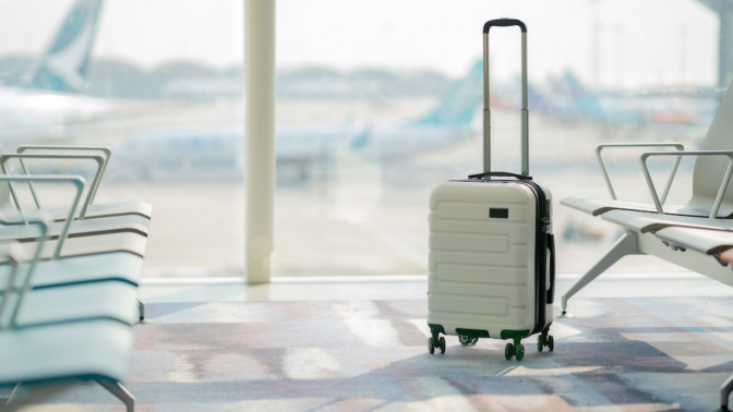 The suitcases in an empty airport hall, traveler cases in the departure airport terminal waiting for the area, vacation concept, blank space for text message or design