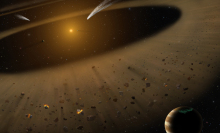 A 3-D rendering of an asteroid belt. A bright object in the background is surrounded by several small rocks. A few rocks have glowing tails behind them, while a larger planet sits in the foreground.