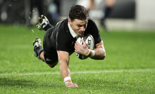 Beauden Barrett of New Zealand scores a try