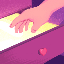 hand reaching into glowing drawer