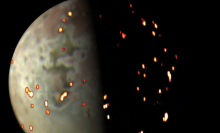 The reds, yellows, and whites overlaid on this image of Jupiter's volcanic moon Io show areas where heat is radiating from the surface.