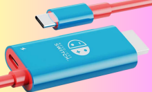 The Nintendo Switch conversion cable overlaid on a gradient background, in blue and coral colors.