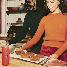 a couple bakes as a red JBL speaker sits on the counter