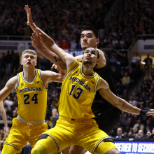 Michigan Wolverines forward Olivier Nkamhoua blocks out Purdue Boilermakers center Zach Edey during a men's college basketball game between the Michigan Wolverines and the Purdue Boilermakers on January 23, 2024, at Mackey Arena in West Lafayette, Indiana..