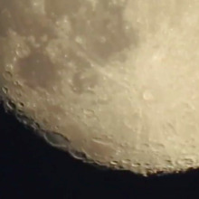 Super long camera zoom goes from city street to moon’s surface