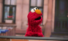 elmo behind a wall